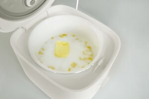 Add butter into rice cooker